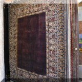 R77. Wide bordered handknotted wool rug. Approx. 8' x 10'